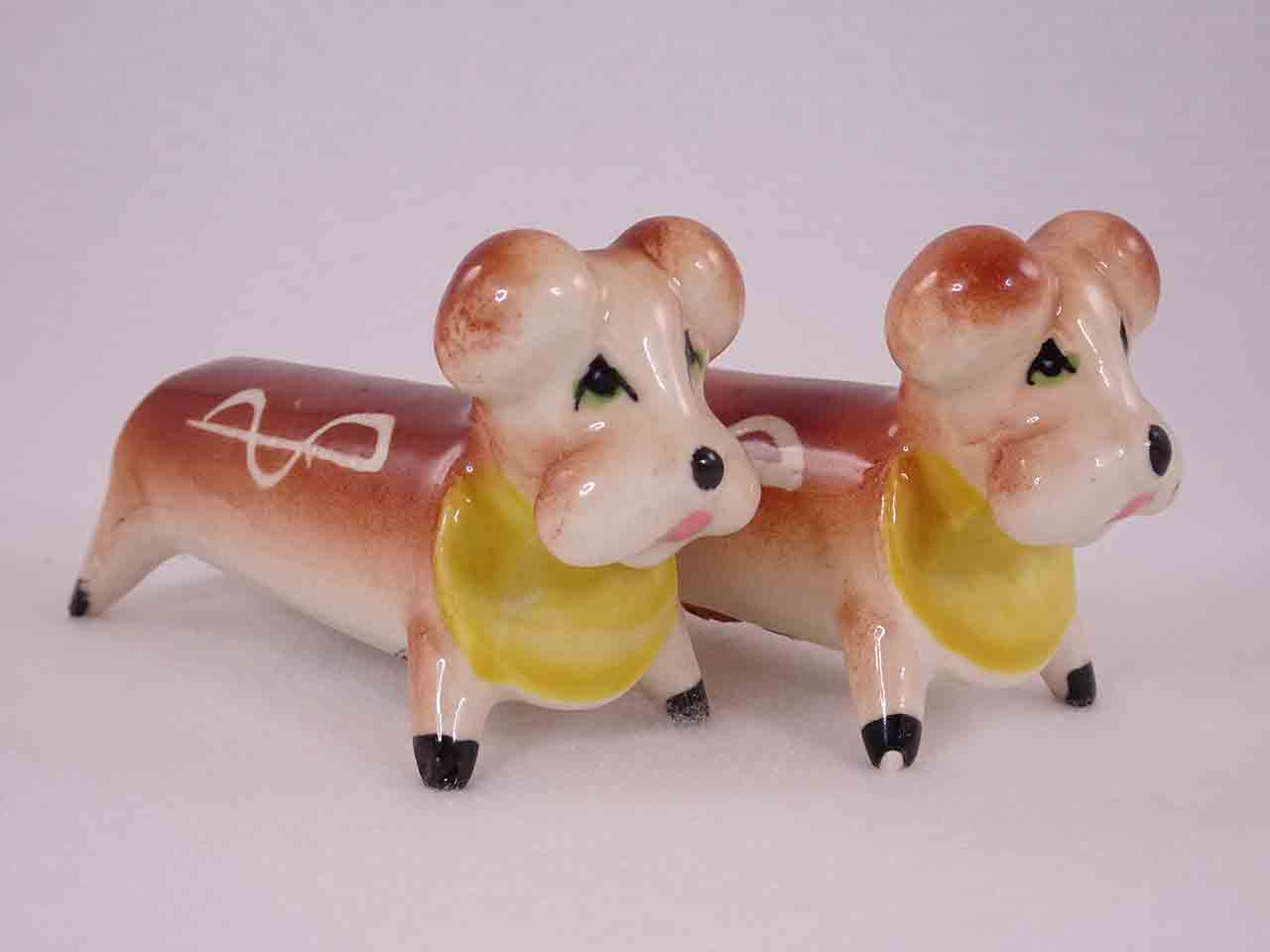 49130 Longer animals with white squiggly lines on their sides salt and pepper shakers - dogs